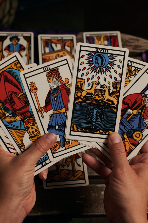 Close-up of a fortune teller reading tarot cards